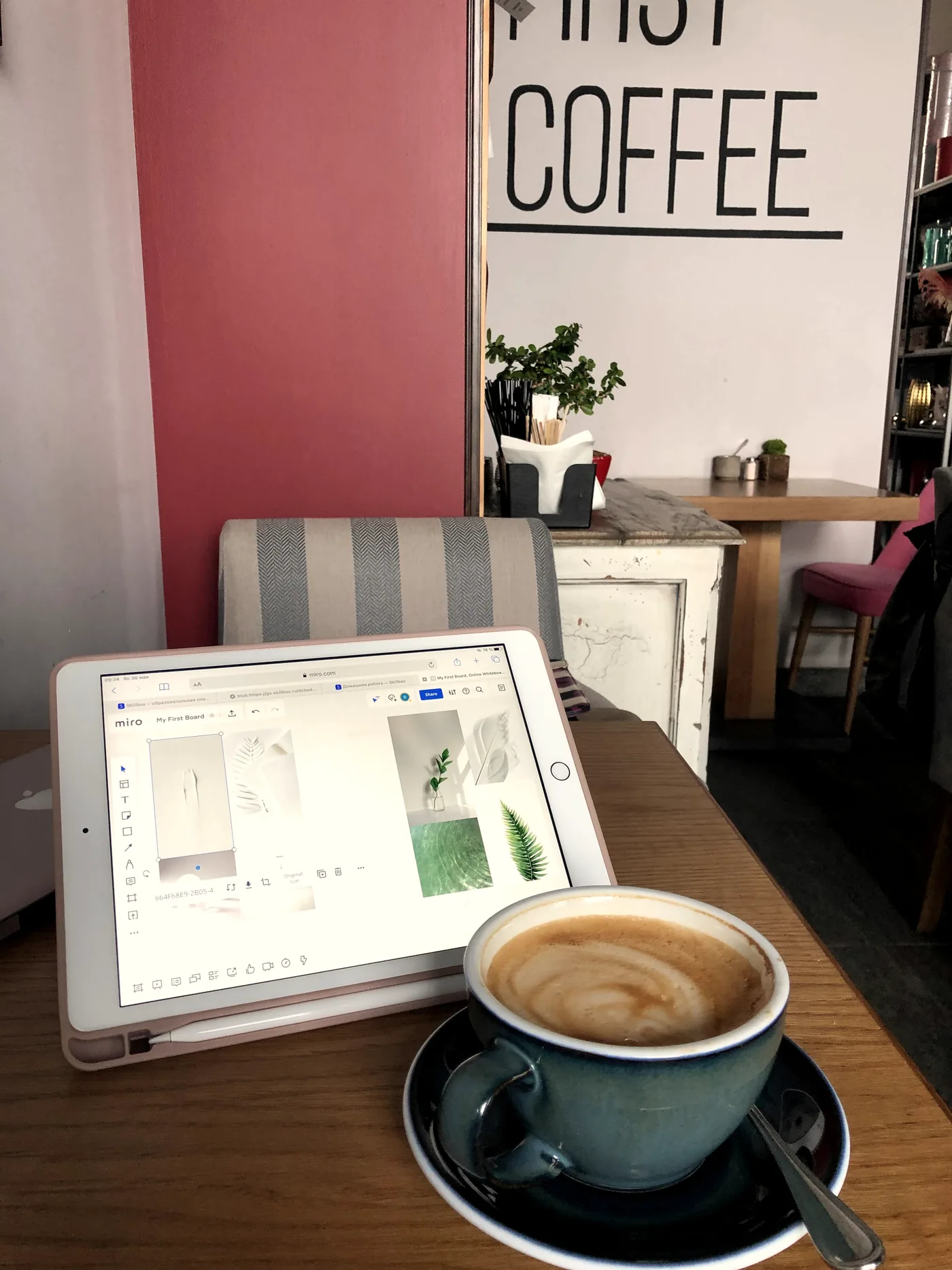 Moodboard on an iPad next to a coffee