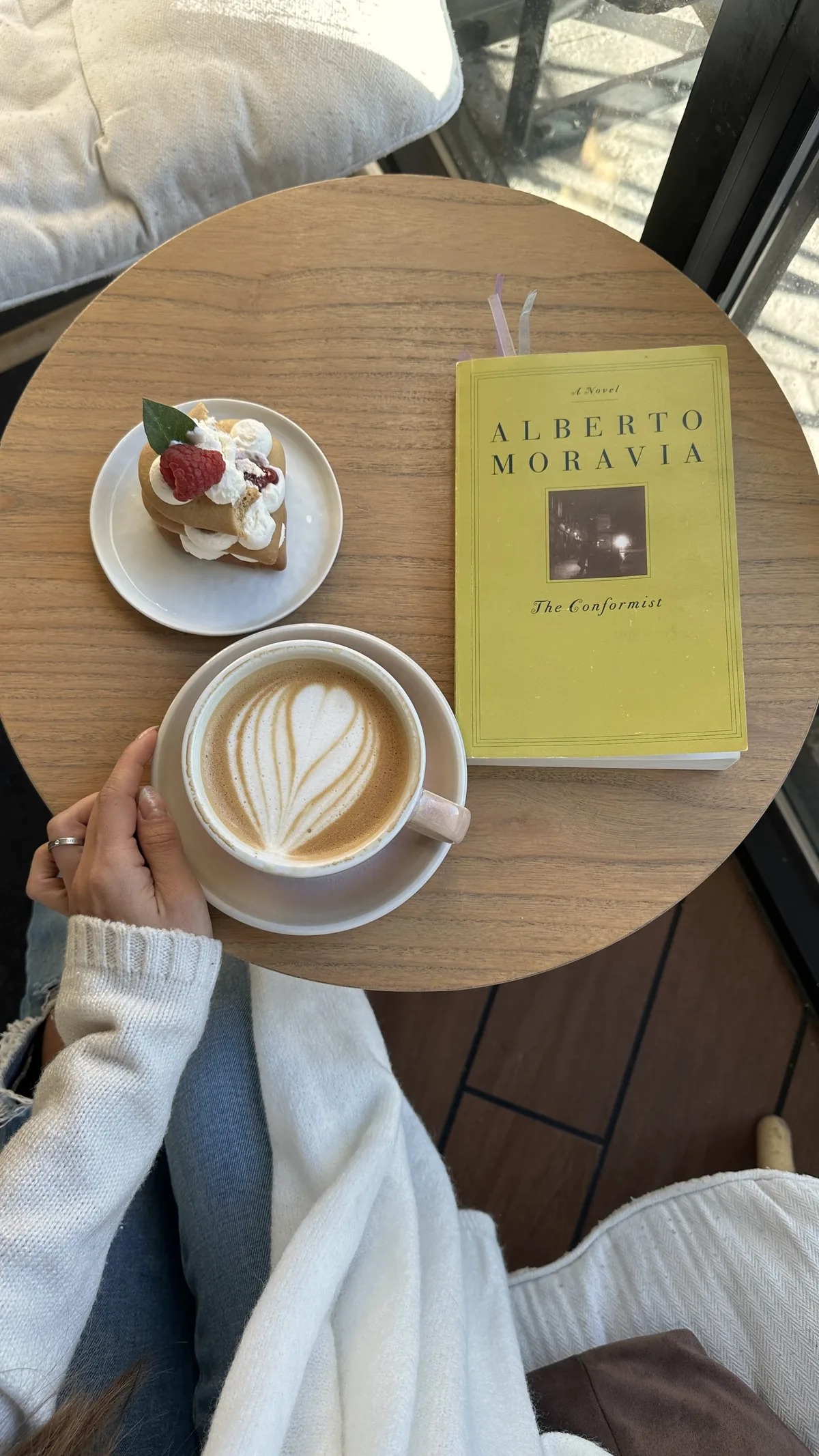 The Conformist by Alberto Moravia with a latte